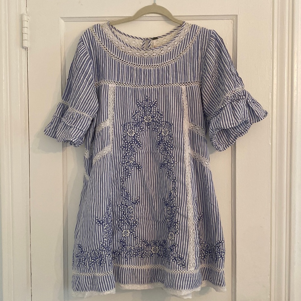 Free People mini dress. Blue with crochet detailing and pockets. Size medium